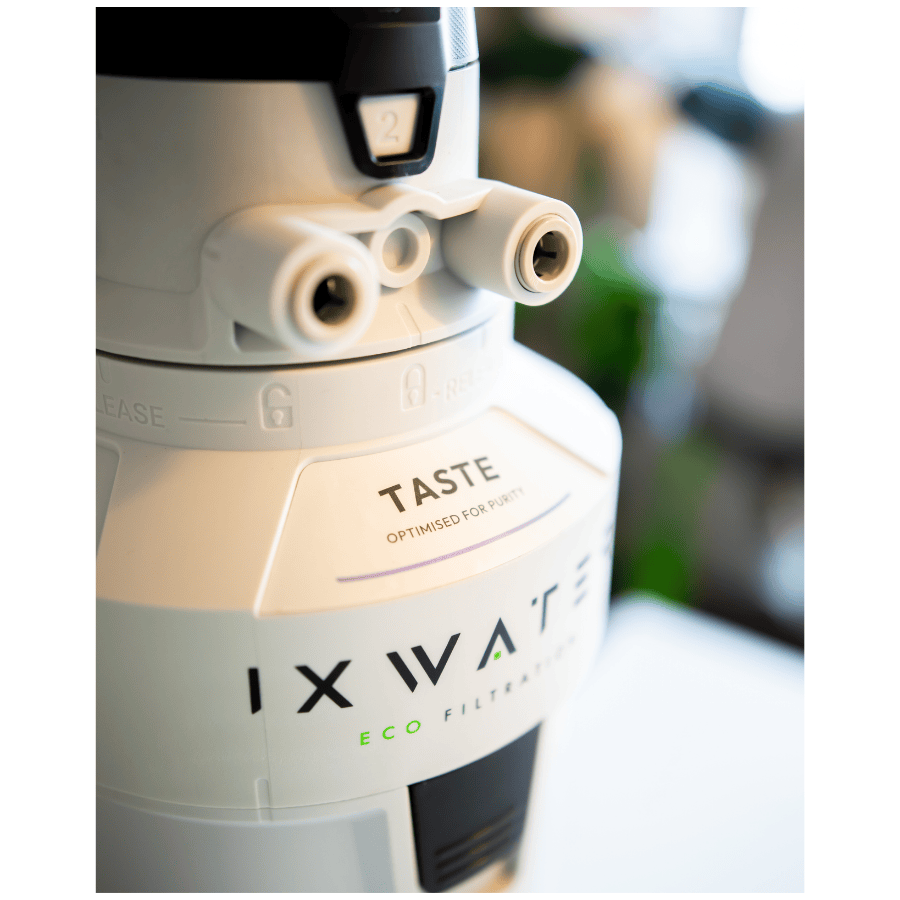 IXWATER water filter with 'Taste'  feature on a blurred background